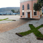 Two roll on lawns X's in front of a old church for the Hermanus Fine arts Festival