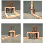 Installation of bricks that run over and through a chair, photo documentation.