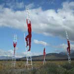 Sculpture installation of men climbing ladders into eternity as part of the Klein Karoo National Arts Festival, Oudtshoorn, South Africa.